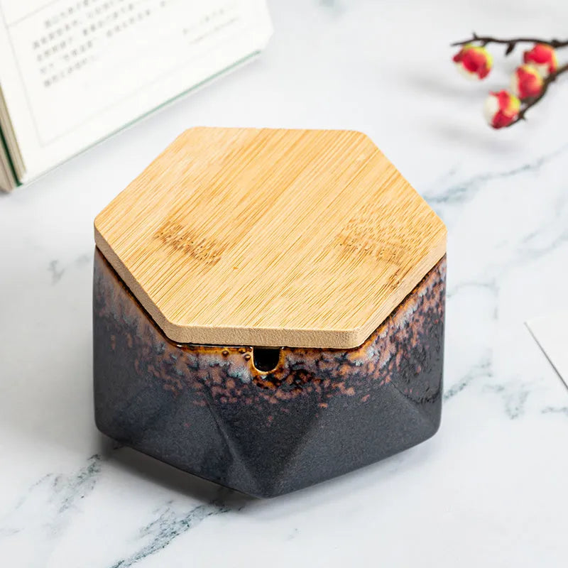Ceramic ashtray with lid, Nordic style, available in multiple colours, on a tabletop