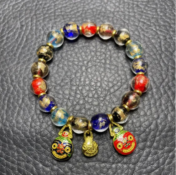 Ancient French Glaze Year glass bracelet with geometric shapes and auspicious court patterns in one of six colours.
