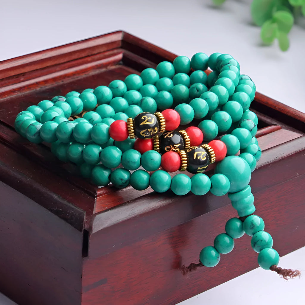 Turquoise Tibetan bracelet with 108 polished synthetic stone beads in 6mm and 8mm sizes
