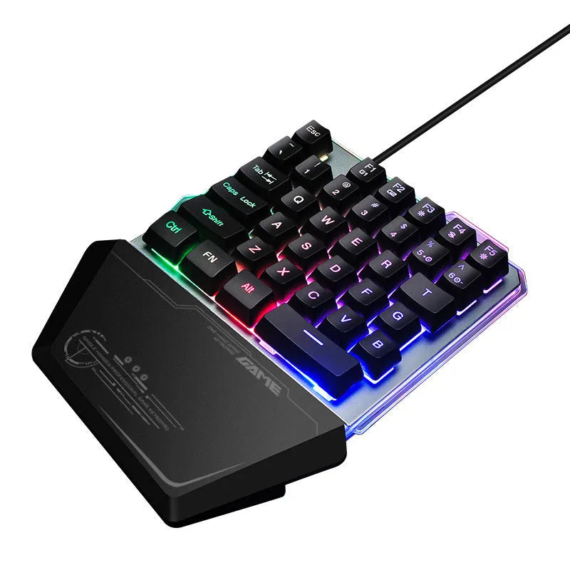 Black G40 Flow one-handed mechanical keyboard with RGB backlit keys on a desk.