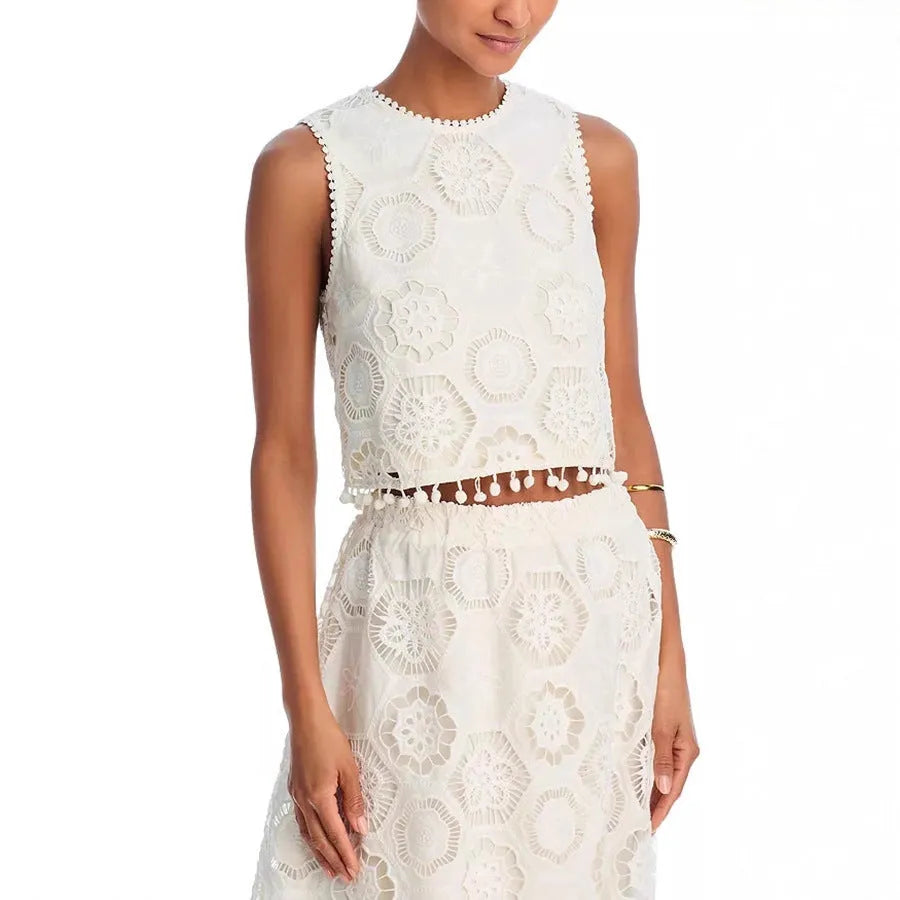 White sleeveless women’s suit with embroidered long skirt and top set