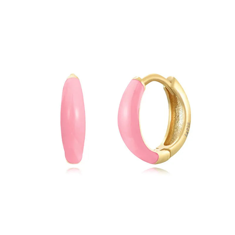 A pair of curved U-shaped epoxy earrings with a translucent blue dripped oil finish and a silver hook on a white background.