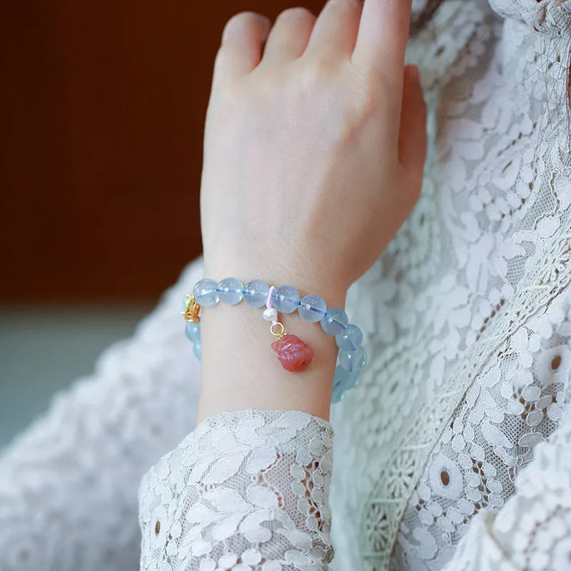 Aquamarine DIY bracelet for women with Fengjiu fox charm, showing pearl and crystal design options.