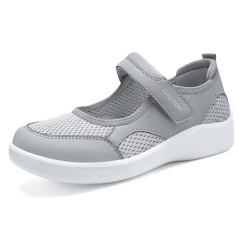 Women's grey mesh slip-on casual shoes with Velcro fastening and flat polyurethane sole