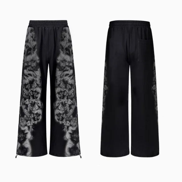 Streetwear co-ord set featuring printed loose trousers, a matching hoodie, and seven-inch shorts on a neutral background.