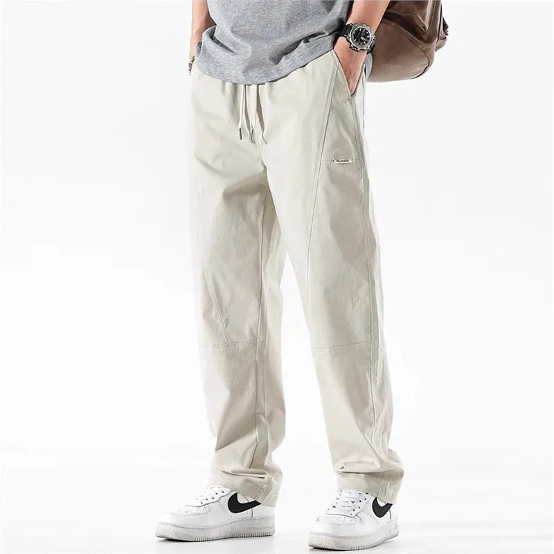 Cotton wide-leg casual trousers with elasticated waistband in black and milky white colours