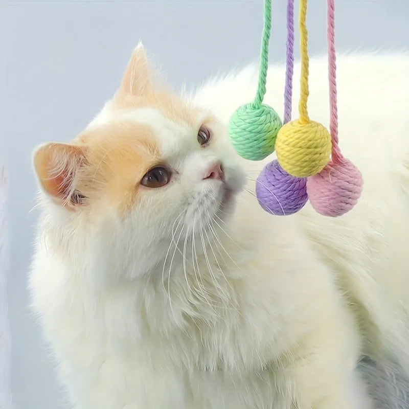Colourful cat toy ball with rope attachment and built-in bell for interactive pet play