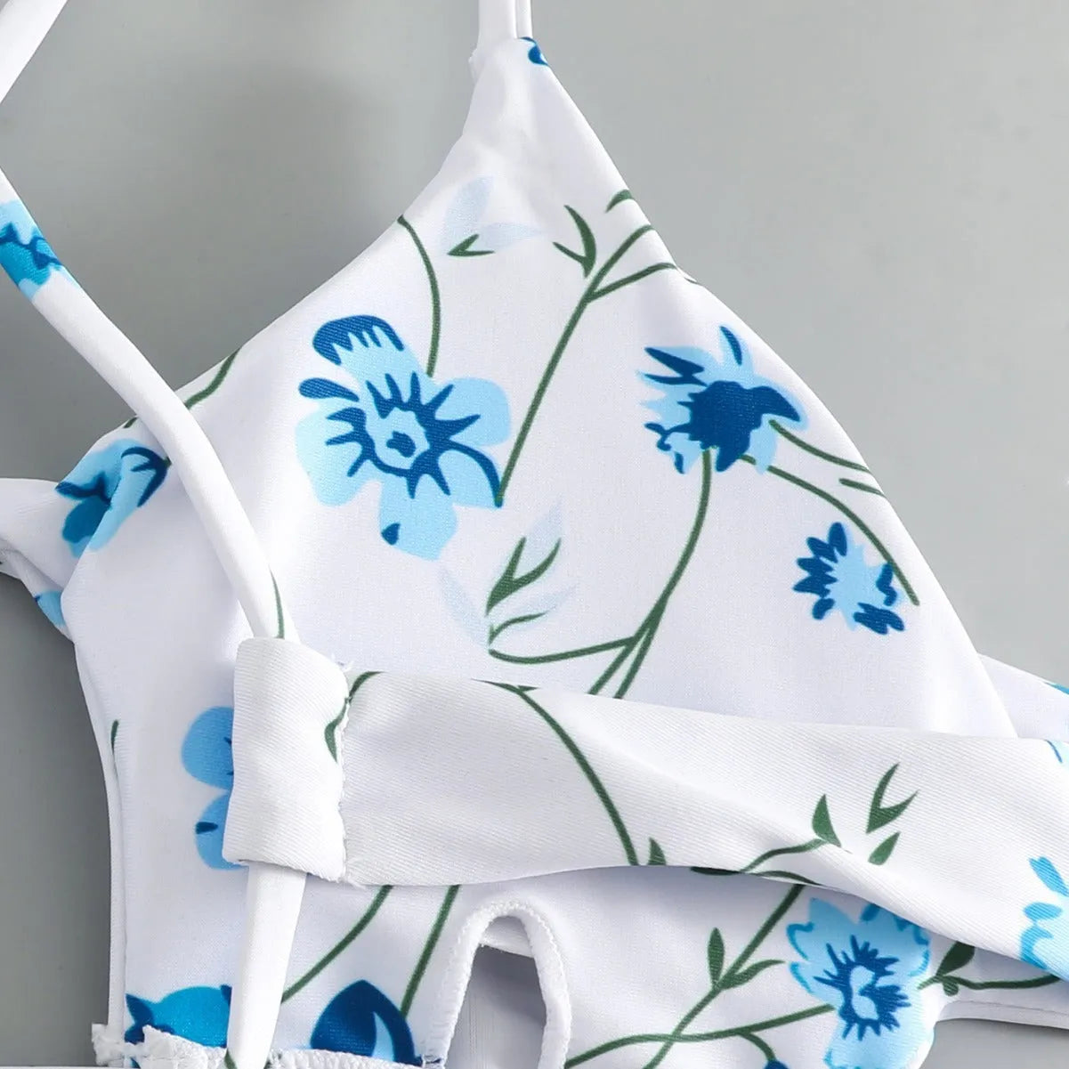 Women's floral swimsuit set with tie-neck triangle top and matching shorts