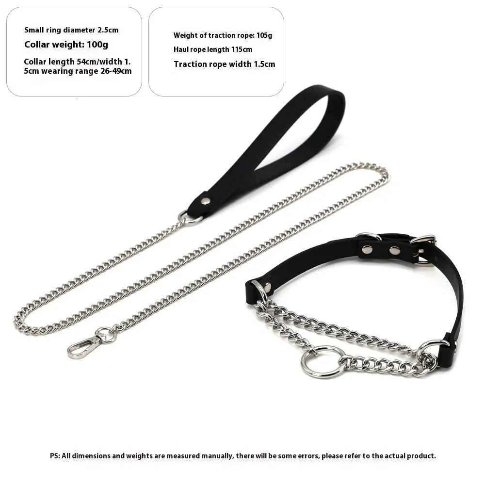 Black leather collar with chain detail and attached black leash on a dark background.