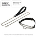 Black leather collar with chain detail and attached black leash on a dark background.