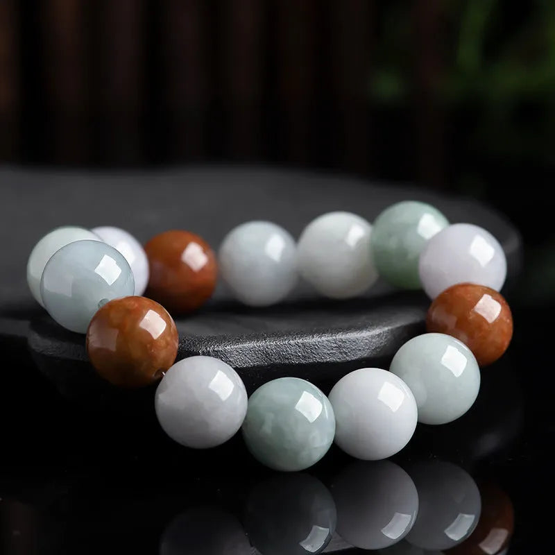 Close-up of a women's bracelet with round 13mm Myanmar jade beads in three colours.