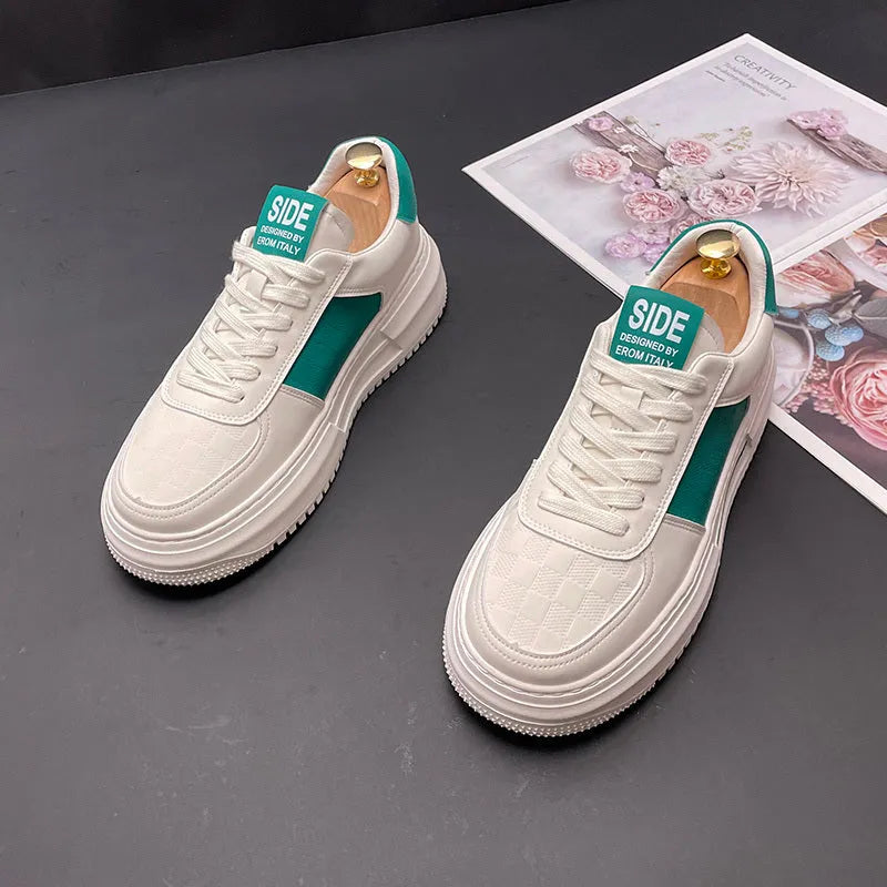 A pair of white, black, and green casual sports shoes with cloth uppers and rubber foam soles.