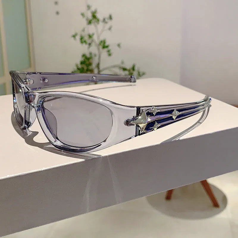 Black frame sports sunglasses with blue polycarbonate lenses on a wooden surface.