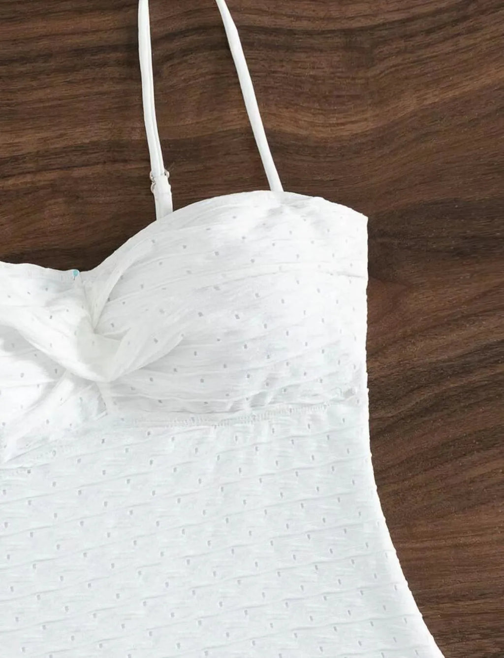 White women's one-piece swimsuit with briefs style on a mannequin