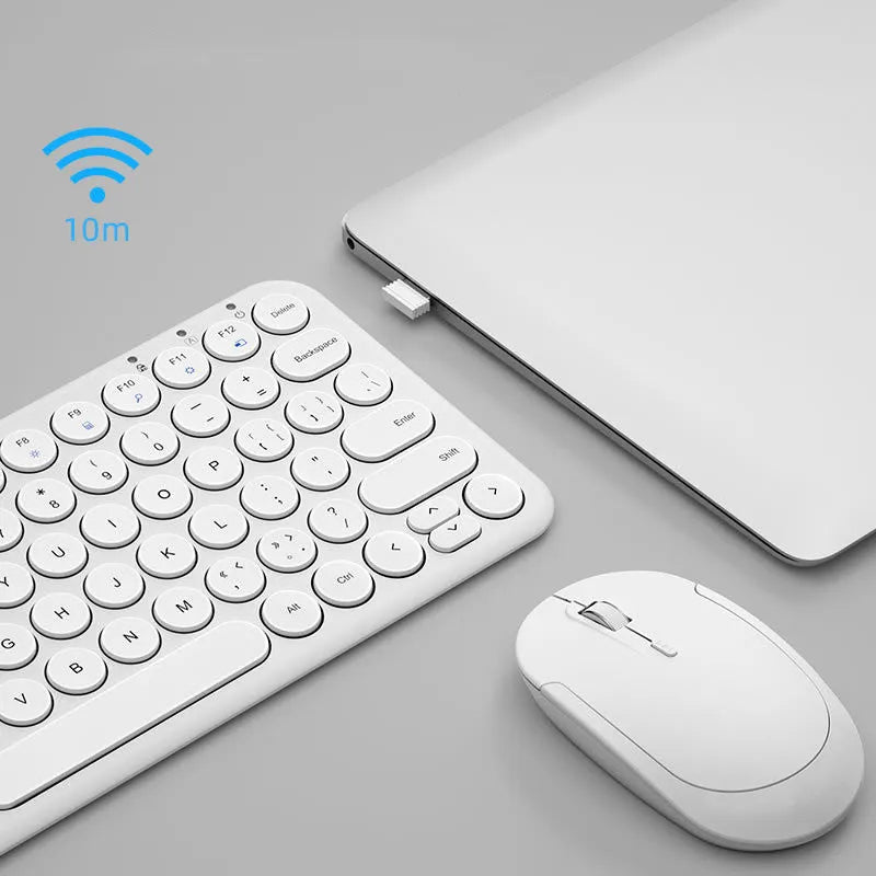 White ultra-thin wireless keyboard and mouse set with USB receiver on a wooden desk