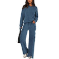 Women's long sleeve polyester sports suit set shown in a colour option, featuring a top and full-length trousers with splicing detail.