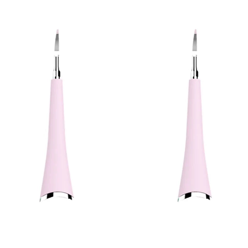 Pink and blue waterproof electric dental scaler tool on a bathroom counter with charging cable.