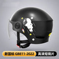 Khaki coloured half helmet for adults on an electric scooter, featuring a long mirrored visor.