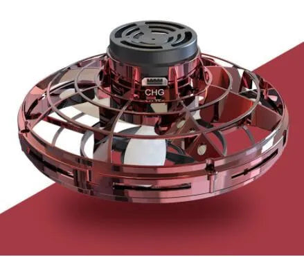 Blue rotating flying gyro induction drone toy made of plastic, 4x8cm, held in hand showing its compact size