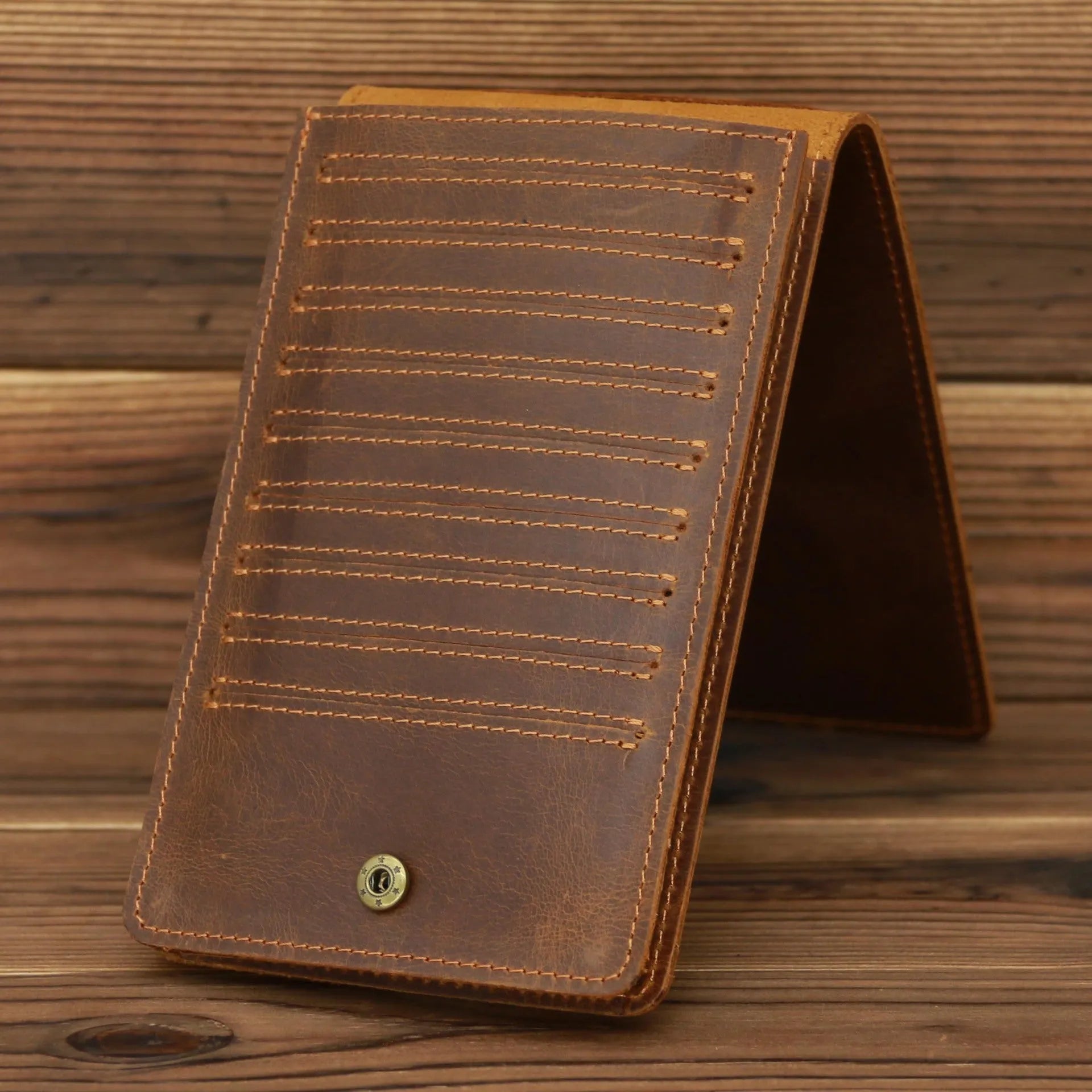 Men's long leather card wallet in crazy horse hide with 18 card slots and a phone compartment.