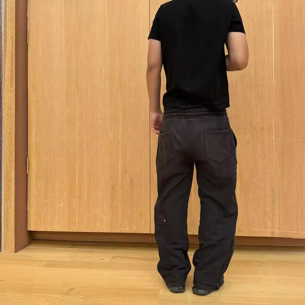 Men's loose fit cropped sweatpants with rope drawstring waist, available in black, gray, and green