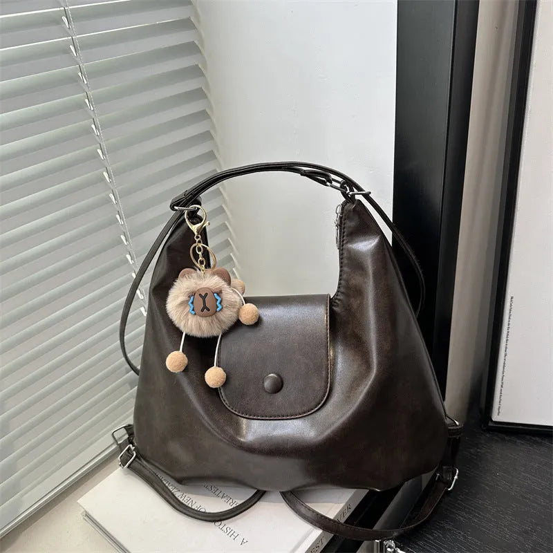Women's leather shoulder bag in horizontal square shape with single strap