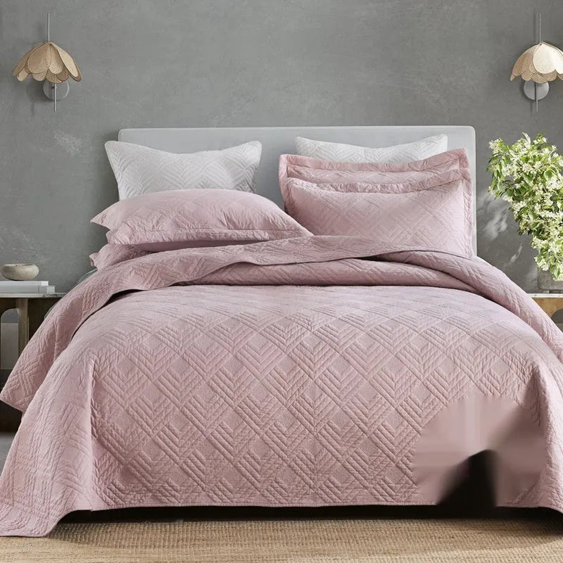 Double-sided pure cotton bed cover three-piece set in a light grey damascus pattern on a bed.