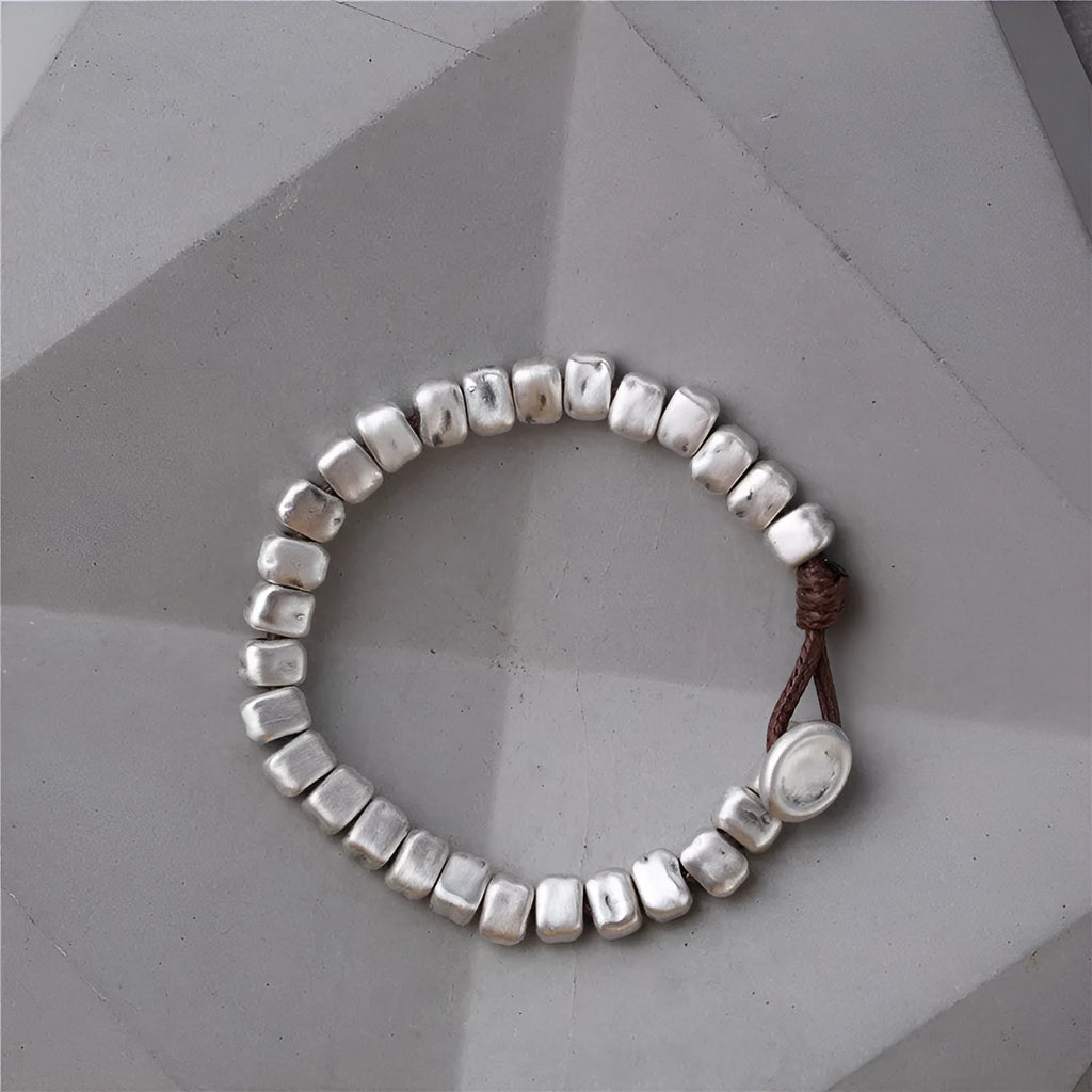 Handmade silver bracelet with irregular square design and wooden elements on 17cm elastic band