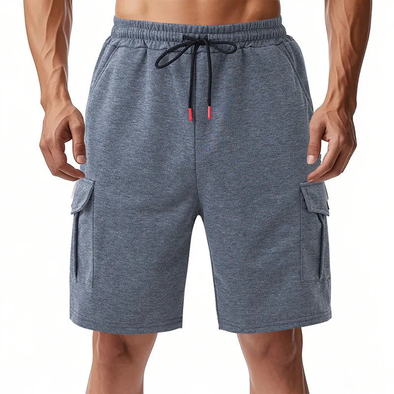 Light grey loose-fit cargo shorts made from soft terry fabric, showing multiple pockets.