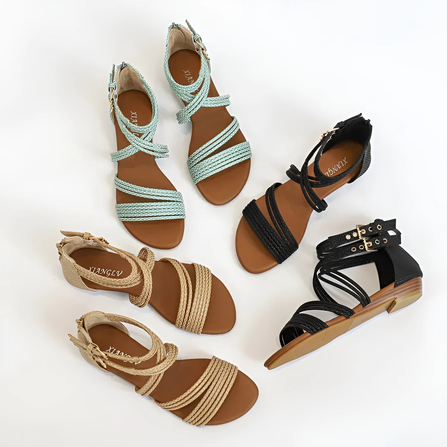 Women's open-toe Roman sandals with cross-strap design, wedge heel, and back zipper in light green.