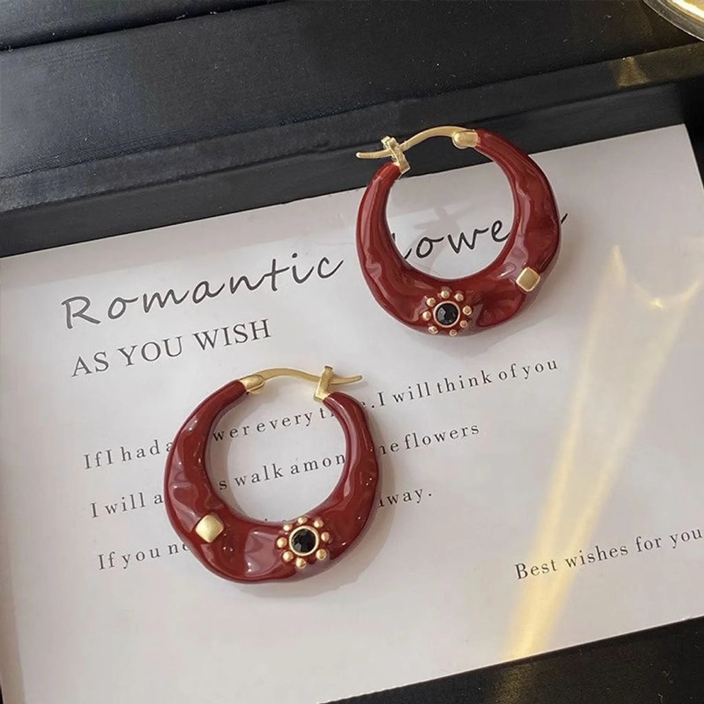 Hong Kong style retro ear studs with dripping oil texture and rhinestone decoration in black or red colour options