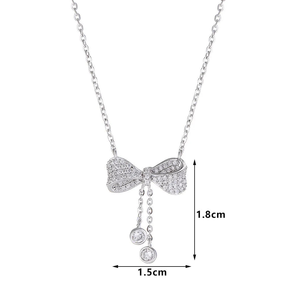 Sterling silver bow pendant necklace with O-ring chain on a 40-45cm adjustable chain.