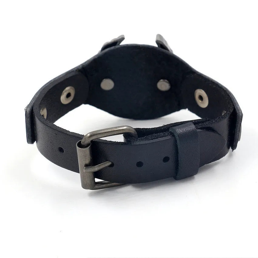 Black leather geometric bracelet with alloy eagle watch-buttom closure on wrist