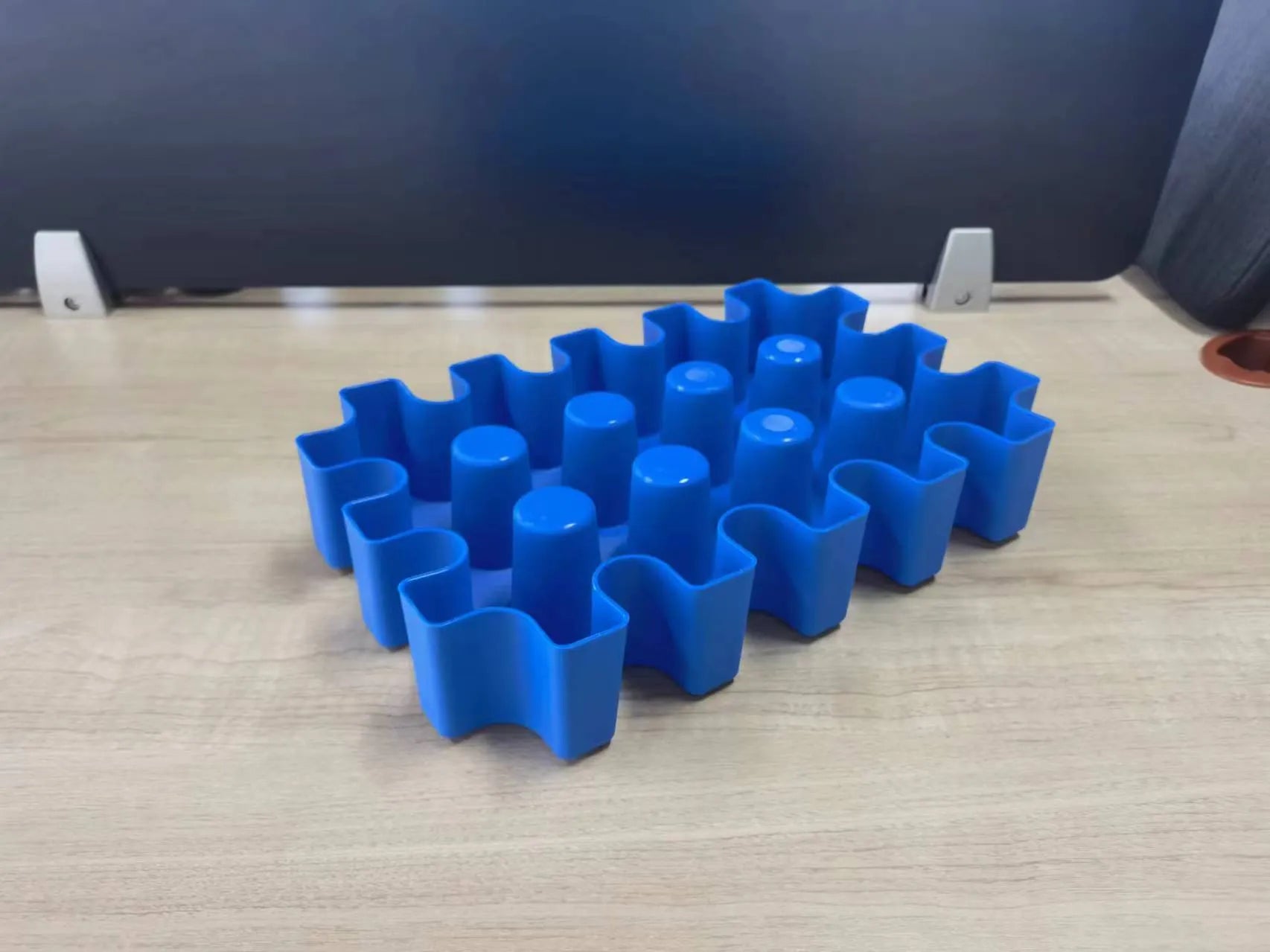 Blue plastic reusable ice block maker tray for outdoor coolers and camping.
