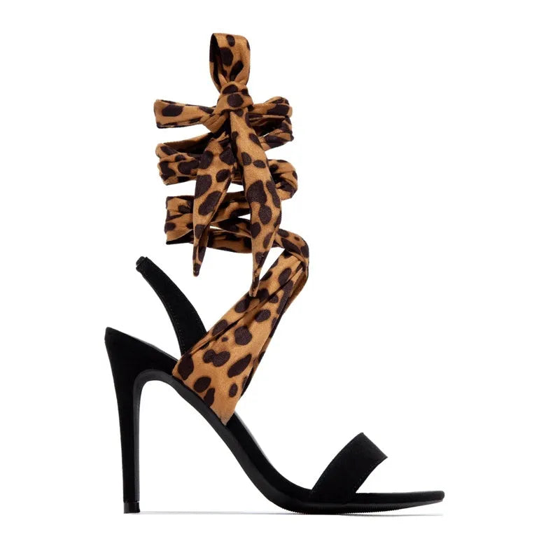 Light brown leopard print women's high-heel sandals with cross straps and an 8cm fine heel on a rubber sole.