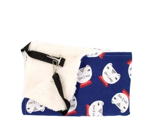 Double-sided lambskin cat hammock nest hanging in a cat cage with beige cat print pattern