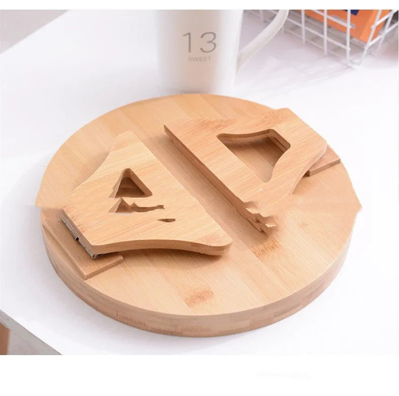 Wooden clip-on sofa tray table with carved surface in bamboo colour, attached to armrest holding snacks and remote