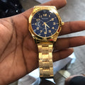 Gold-tone unisex wristwatch with round dial and adjustable metal strap, 40mm case