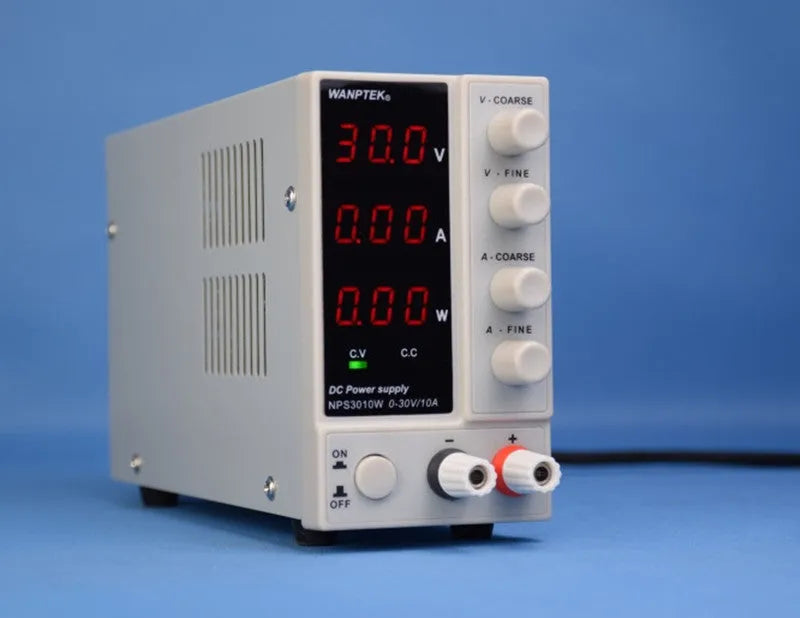 White adjustable DC power supply unit with digital display for electronics repair.