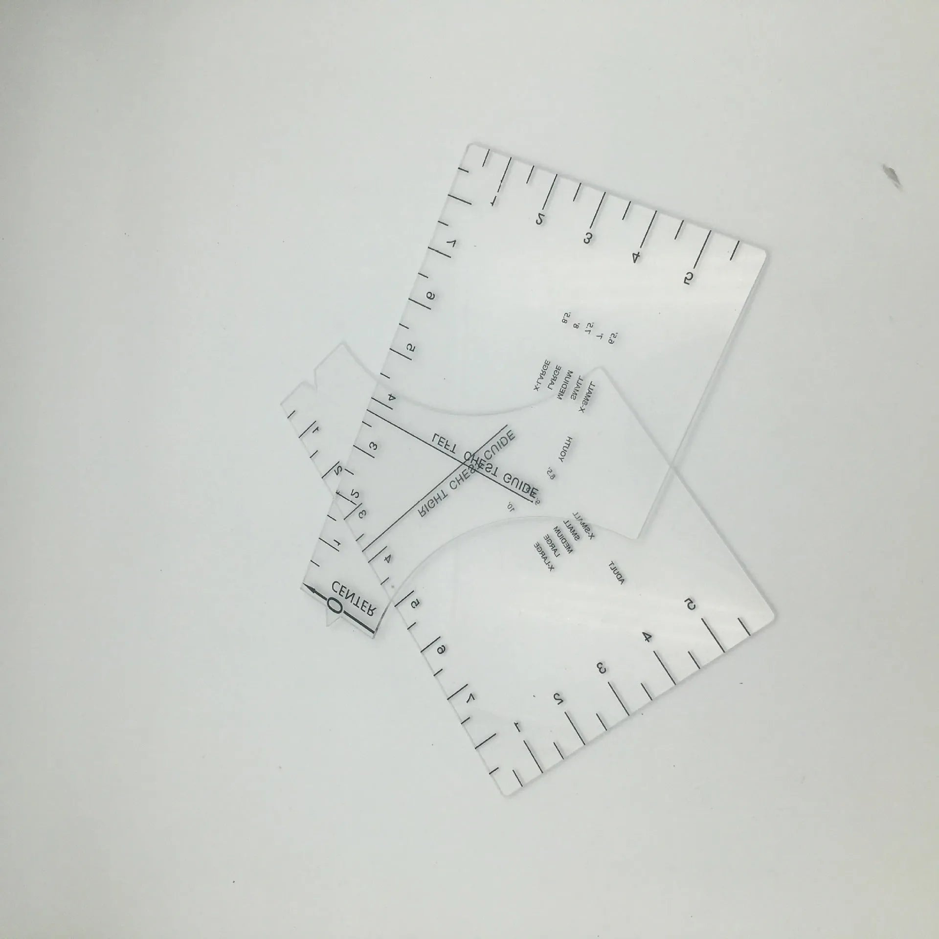 Transparent acrylic sewing ruler measuring 10 by 6 inches for T-shirt patch alignment