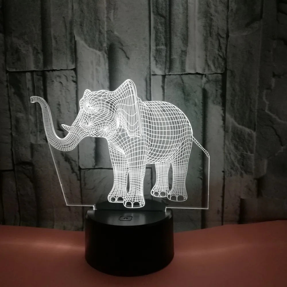 3D elephant-shaped acrylic desk lamp with seven colour modes, USB-powered, on a desk surface