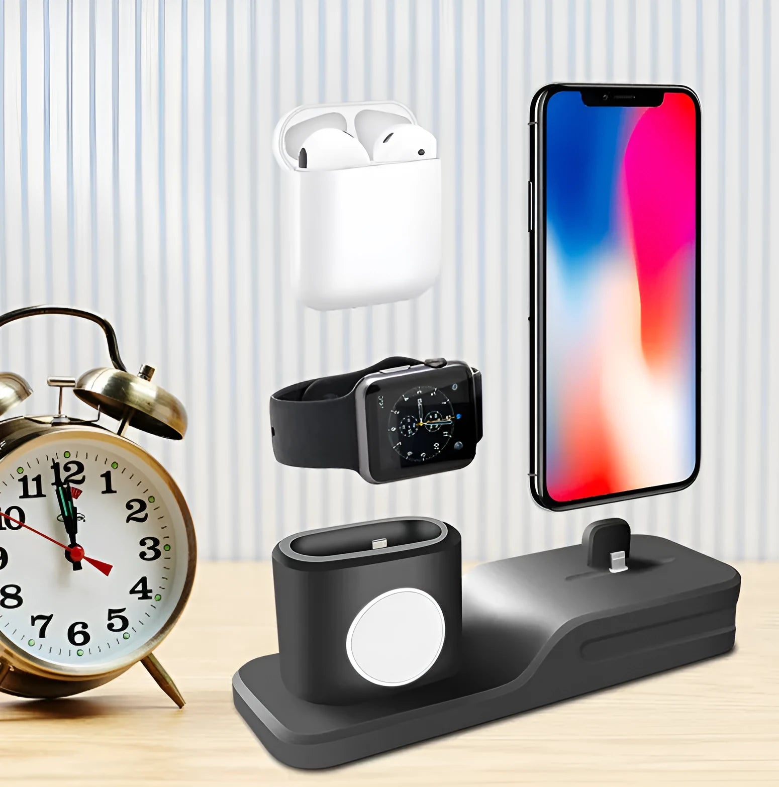 Black silicone 3-in-1 wireless charging station for Apple Watch, AirPods and iPhone on a desk