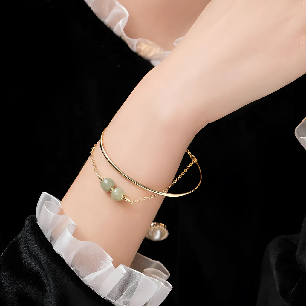 Women's Hetian jade lucky beads bracelet with gold inlay in a fake two pieces style.