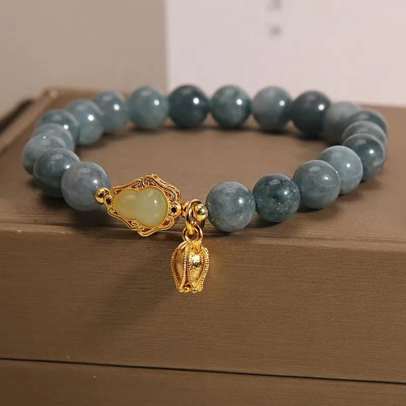 Natural stone bracelet for women with a blue electroplated gourd lotus flower pendant.