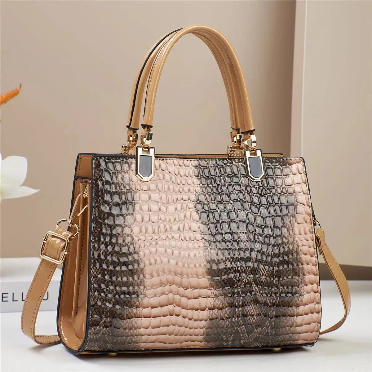 Women's soft PU one shoulder handbag showing multiple internal zip compartments and neutral colour option
