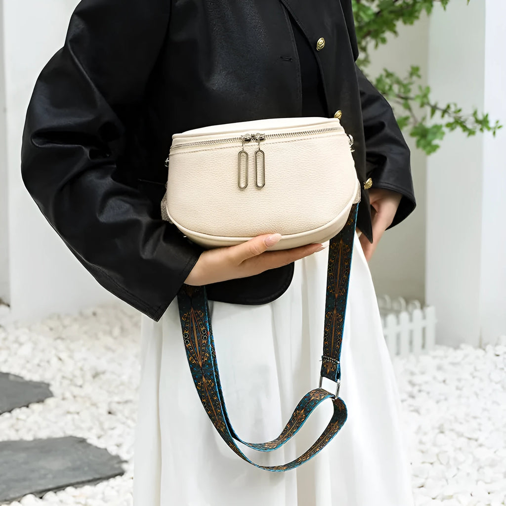 Women's soft PU leather messenger bag in saddle shape with cross-body strap