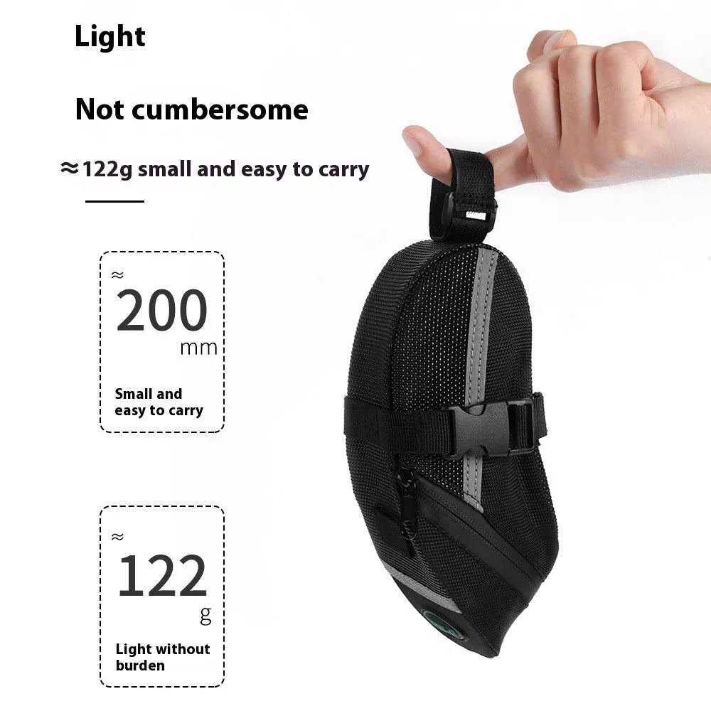Black quick release bicycle saddle bag mounted under a bike seat