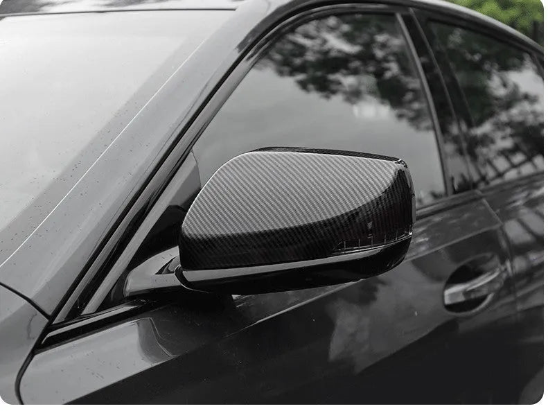 ABS plastic rearview mirror cover for Cadillac CT5 and CT6 models in carbon fibre, silver, or rain frame pattern.
