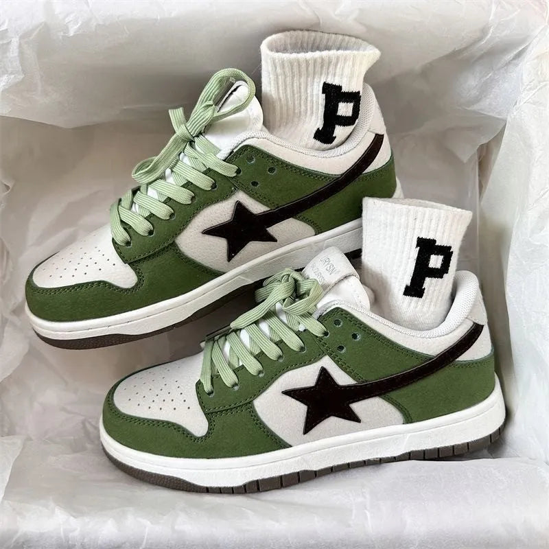 Women's retro green lace-up board shoes with round toe and flat rubber sole on a plain background