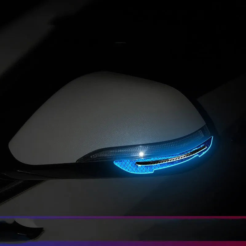 Blue reflective warning tape applied to car wheel bumper showing 17mm width and universal fit design